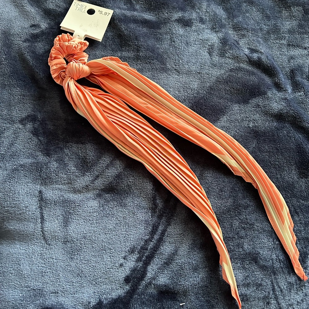 Peach and white hair tie with tail. Brand new with tags